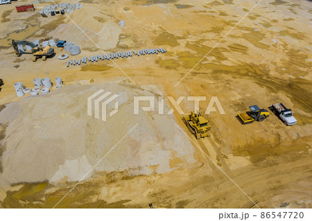 Aerial view stacked pipe at concrete drainage pipes for building with preparation land for construction site Aerial view stacked pipe at concrete drainage pipes for building with preparation land for construction site 86547720