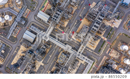 Oil refinery plant at industrial zone, Aerial view oil and gas business petrochemical industrial, Oil refinery factory white oil storage tank and pipeline steel, Ecosystem and healthy environment. 86550209