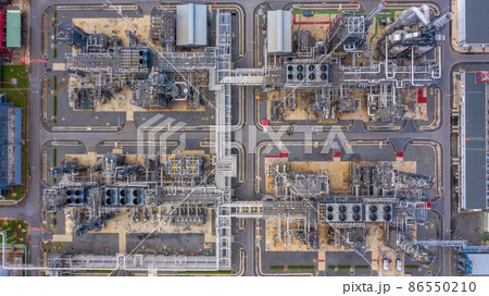 Oil refinery plant at industrial zone, Aerial view oil and gas business petrochemical industrial, Oil refinery factory white oil storage tank and pipeline steel, Ecosystem and healthy environment. 86550210