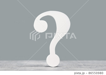 White question mark symbol on a gray desk background White question mark symbol on a gray desk background 86550980