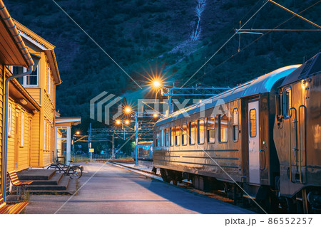 Flam, Norway. Famous Railroad Flamsbahn. Green Norwegian Train Near Railway Station. Electric trainFlam, Norway. Famous Railroad Flamsbahn. Green Norwegian Train Near Railway Station. Electric train. Flam, Norway. Famous Railroad Flamsbahn. Green Norwegian Train Near Railway Station. Electric trainFlam, Norway. Famous Railroad Flamsbahn. Green Norwegian Train Near Railway Station. Electric train. 86552257
