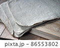 Uncut Dried Tofu Skin, Dried Bean Curd sheet on wooden table. Close up. 86553802
