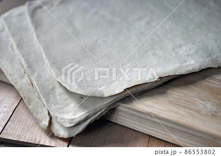Uncut Dried Tofu Skin, Dried Bean Curd sheet on wooden table. Close up. 86553802