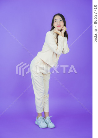Portrait beautiful young asian woman smile with action Portrait beautiful young asian woman smile with action 86557710