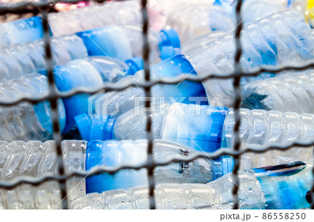 Plastic bottles and containers prepared for recycling Plastic bottles and containers prepared for recycling 86558250