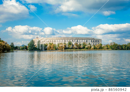 Congress Hall in Nuremberg, view from the lake. water surface and blue sky 86560942