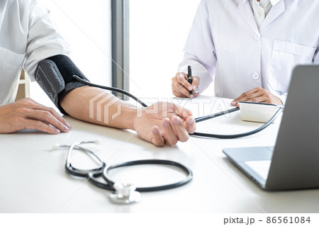 Doctor being measuring examination patient and checking blood pressure to symptom diagnosis illness in hospital Doctor being measuring examination patient and checking blood pressure to symptom diagnosis illness in hospital 86561084
