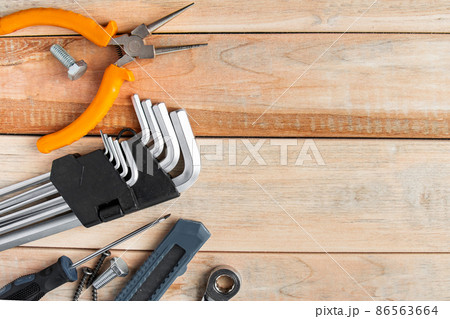 International Father's Day. Greeting card concept. Set of construction tools on a wooden background. Place for text. 86563664