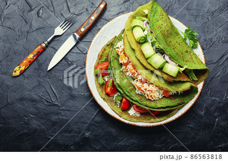 Pancakes with vegetable filling Pancakes with vegetable filling 86563818
