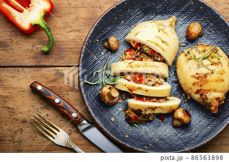 Grilled squid with mushroom stuffing 86563898