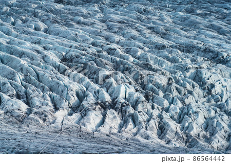 Massive glacier texture background, long shot with cracks 86564442