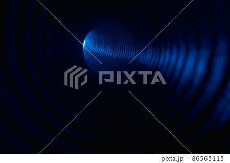 Fluorescent background. Blur neon light. Spotlight illumination. Defocused led blue color glow ray in ribbed texture swirl tunnel on dark black copy space. 86565115