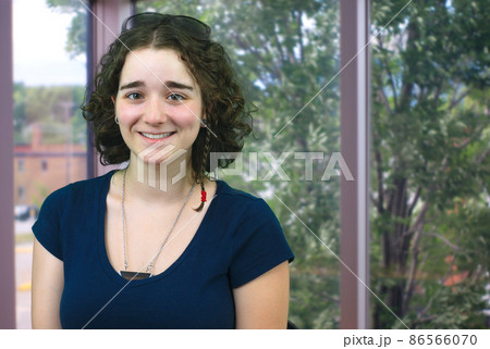 young woman employee at the office near window 86566070