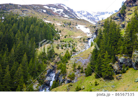 Aerial photography high in the mountains. Mountain road view, selective focus. 86567535