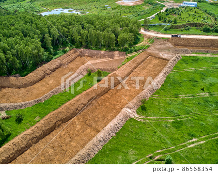 Overburden removal during sand pit preparation, aerial view Overburden removal during sand pit preparation, aerial view 86568354