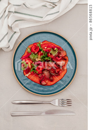 fillet and fresh vegetable salad of lettuce, arugula, spinach, cucumber and tomato. Healthy lunch menu. Diet food. fillet and fresh vegetable salad of lettuce, arugula, spinach, cucumber and tomato. Healthy lunch menu. Diet food. 86568815