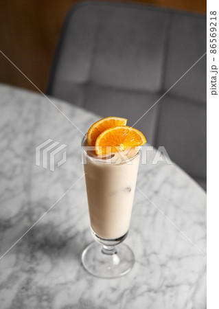 Creamy mocktail. Cold non-alcoholic cocktail with lemon juice and sweetened condensed milk. delicious beverage Creamy mocktail. Cold non-alcoholic cocktail with lemon juice and sweetened condensed milk. delicious beverage 86569218
