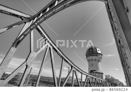 Steel bridge with water tower in black and white Steel bridge with water tower in black and white 86569224