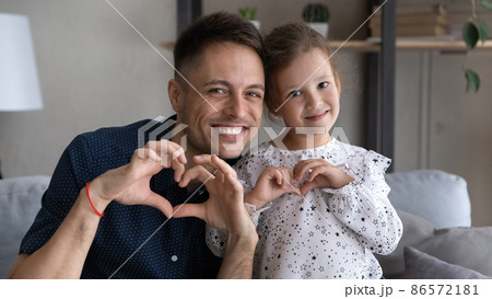 Bonding happy friendly two generations family looking at camera. 86572181