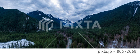 Aerial Panoramic View from above of Canadian Nature Valley around Mountains. Aerial Panoramic View from above of Canadian Nature Valley around Mountains. 86572669