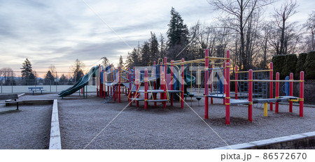 Empty playground during a frosty winter morning. Empty playground during a frosty winter morning. 86572670
