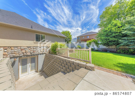 Basement entrance with glass panels on the double doors Basement entrance with glass panels on the double doors 86574807