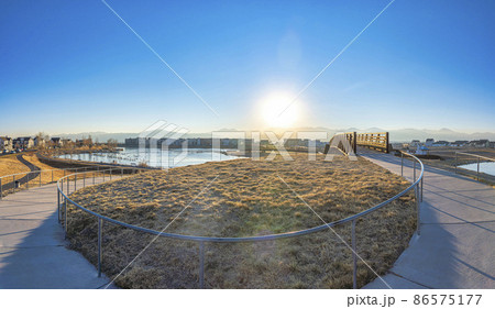 Curved pathway metal barriers near the bridge over the Oquirrh lake at Daybreak, South Jordan, Utah 86575177