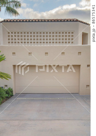 Garage exterior with beige walls and doors at La Jolla, California Garage exterior with beige walls and doors at La Jolla, California 86575341