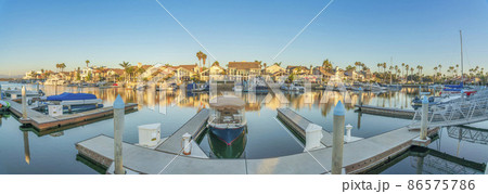 Docks with boats at the front of a houses at Coronado, San Diego, California Docks with boats at the front of a houses at Coronado, San Diego, California 86575786
