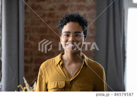 Happy millennial Afro American business lady head shot portrait 86579587