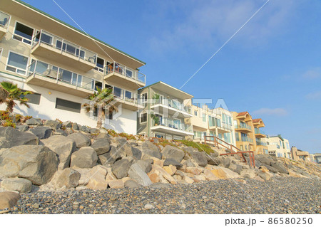 Beachfront houses with view decks and glass railings at Oceanside, California 86580250