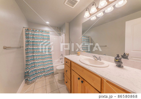 Bathroom interior with decorative liquid soap owl bottle on the marble top 86580868