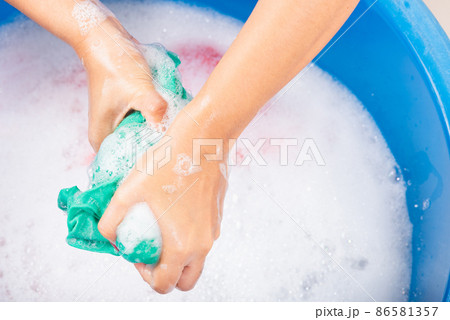 Female squeeze wring out wet fabric cloth Female squeeze wring out wet fabric cloth 86581357