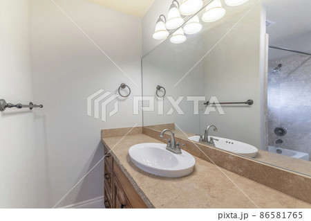 Bathroom interior with vanity sink and towel bar holder 86581765