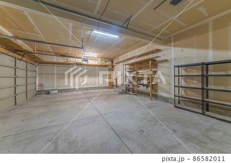 Large garage interior with wall filler white markings and shelves Large garage interior with wall filler white markings and shelves 86582011