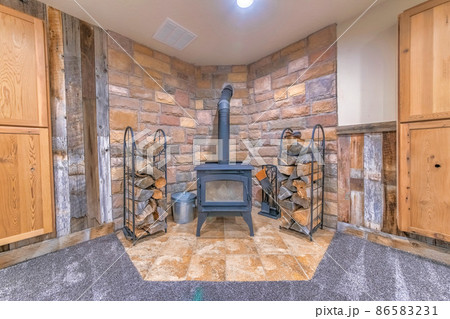 Interior of a fireplace with vintage wood burning stove Interior of a fireplace with vintage wood burning stove 86583231