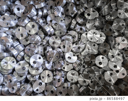 full frame view on heap of round steel cylindrical parts after eccentric drilling full frame view on heap of round steel cylindrical parts after eccentric drilling 86588497