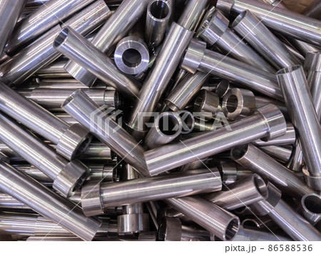 pile of shiny steel tubes after cnc turning operations - abstract full frame indistrial background 86588536