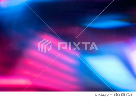 Futuristic background. Blur neon glow. Fluorescent illumination. Defocused ultraviolet pink blue color light abstract pattern dust scratches noise texture on dark overlay. 86588718