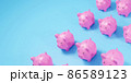 Pink piggy bank on blue background. 3D Illustration 86589123
