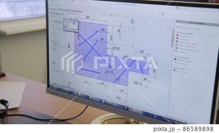 A close-up of a computer showing a drawing of a room on the screen. Building A close-up of a computer showing a drawing of a room on the screen. Building 86589898