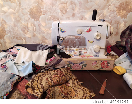 Home work on sewing machine. Handmade fashion equipment. 86591247