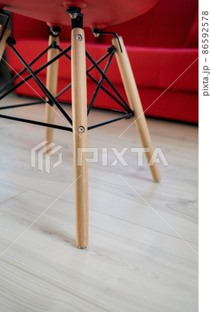 legs of red chair on floor legs of red chair on floor 86592578