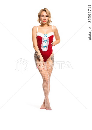 Slim seductive woman in Santa outfit in studio 86592711