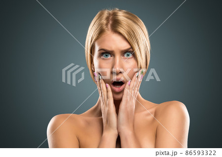 Portrait beautiful blond woman with long hair and blue eyes Portrait beautiful blond woman with long hair and blue eyes 86593322