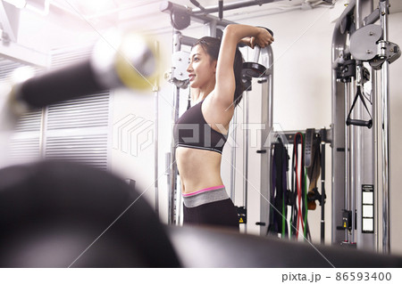 young asian woman exercising working out in gym 86593400