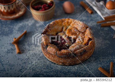Breaded rustic pie with berries 86594212