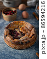 Breaded rustic pie with berries 86594216