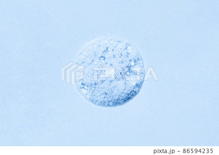 Drop of soap, shower gel or shampoo foam. The image is tinted in blue. 86594235
