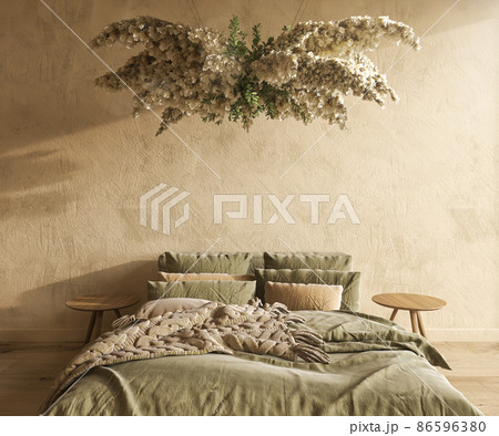 Farmhouse interior bedroom mockup. Bed with green blanket and chandelier with dry flowers. 3d render illustration rustic style on empty beige wall. Farmhouse interior bedroom mockup. Bed with green blanket and chandelier with dry flowers. 3d render illustration rustic style on empty beige wall. 86596380